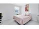 Cozy bedroom with a double bed, a window and a decorative painting on the wall at 3829 Allegany Ln, Sanford, FL 32771