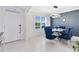 Dining room features a glass table with plush chairs and modern chandelier at 3829 Allegany Ln, Sanford, FL 32771
