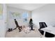 Home exercise room with carpeted floors, weight lifting bench, exercise bike, and a view out the window at 3829 Allegany Ln, Sanford, FL 32771