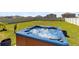 Inviting backyard with a relaxing hot tub surrounded by a well-maintained lawn and a privacy fence at 3829 Allegany Ln, Sanford, FL 32771