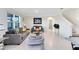 Bright, open living room with modern decor, comfortable seating, and tile flooring at 3829 Allegany Ln, Sanford, FL 32771