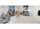 Cozy living room featuring plush sofas, a modern glass table, and stylish accents at 3829 Allegany Ln, Sanford, FL 32771