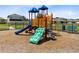 Colorful community playground with slides, climbing structures, and safety surfacing at 3829 Allegany Ln, Sanford, FL 32771