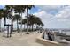 Scenic waterfront walkway lined with palm trees, park benches, and clear views of the bay at 3829 Allegany Ln, Sanford, FL 32771