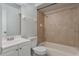 Clean bathroom featuring tiled shower and vanity with modern fixtures at 4136 Pershing Pointe Pl # 2, Orlando, FL 32822