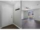 Welcoming entryway leading to a bright living space with a ceiling fan at 4136 Pershing Pointe Pl # 2, Orlando, FL 32822