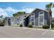 Charming condo exterior with neat landscaping and ample parking space at 4136 Pershing Pointe Pl # 2, Orlando, FL 32822