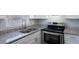 Stylish kitchen with stainless steel appliances and granite countertops at 4136 Pershing Pointe Pl # 2, Orlando, FL 32822