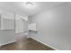Open-concept living room features modern flooring and natural light at 4136 Pershing Pointe Pl # 2, Orlando, FL 32822
