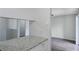 Bright living room with granite counter and open to other spaces at 4136 Pershing Pointe Pl # 2, Orlando, FL 32822