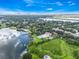 Breathtaking aerial view showcasing the lake community and the city skyline in the distance at 4332 Lake Underhill Rd # 12D10, Orlando, FL 32803
