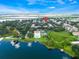 Scenic aerial view of the lake community, highlighting the pool, tennis courts, and lush greenery at 4332 Lake Underhill Rd # 12D10, Orlando, FL 32803