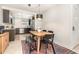 Open-concept dining room and kitchen with modern cabinetry, stainless steel appliances, and stylish lighting at 4332 Lake Underhill Rd # 12D10, Orlando, FL 32803