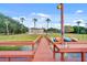 Dock view with the community building, kayaks, and a sink for cleaning fish and the like at 4332 Lake Underhill Rd # 12D10, Orlando, FL 32803