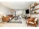 Inviting living room filled with natural light, showcasing a comfortable leather sofa and stylish furnishings at 4332 Lake Underhill Rd # 12D10, Orlando, FL 32803