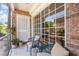 Relaxing screened-in patio with stylish seating, plants, and easy access to the outdoors at 4332 Lake Underhill Rd # 12D10, Orlando, FL 32803