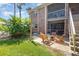 Private outdoor patio with comfortable seating and a view of the surrounding landscape at 4332 Lake Underhill Rd # 12D10, Orlando, FL 32803