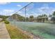 View of fenced community tennis courts with nearby sidewalk and landscaping at 4332 Lake Underhill Rd # 12D10, Orlando, FL 32803