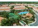 Aerial view of resort community featuring pools, tennis courts and townhomes at 4725 Coral Castle Dr, Kissimmee, FL 34746