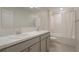 Bathroom featuring a double sink vanity with an enclosed shower-tub at 4725 Coral Castle Dr, Kissimmee, FL 34746