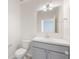 A clean, well-lit half bathroom featuring a modern vanity and fixtures at 4725 Coral Castle Dr, Kissimmee, FL 34746