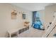 This cozy bedroom features neutral decor, a bunk bed and a tent for a comfortable and inviting space at 4725 Coral Castle Dr, Kissimmee, FL 34746