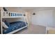 Bedroom with bunk beds, plush carpet, and closet with white doors at 4725 Coral Castle Dr, Kissimmee, FL 34746