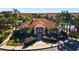The clubhouse features a Mediterranean style roof with lush landscaping at 4725 Coral Castle Dr, Kissimmee, FL 34746