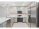 Stylish kitchen with stainless steel appliances, ample storage and counter space at 4725 Coral Castle Dr, Kissimmee, FL 34746