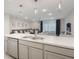 Open kitchen design with a view to the living room and dining area at 4725 Coral Castle Dr, Kissimmee, FL 34746