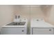Convenient laundry area with side by side, modern, Samsung washer and dryer at 4725 Coral Castle Dr, Kissimmee, FL 34746