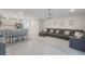 Open-concept living room with modern furniture and neutral decor at 4725 Coral Castle Dr, Kissimmee, FL 34746
