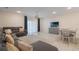 Spacious living room and dining area with plush seating and stylish decor at 4725 Coral Castle Dr, Kissimmee, FL 34746