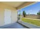 Screened in patio overlooks a backyard with an exit door and gate at 4725 Coral Castle Dr, Kissimmee, FL 34746
