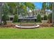 Community sign features green landscaping, well manicured shrubs and flowers at 4725 Coral Castle Dr, Kissimmee, FL 34746