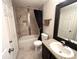Functional bathroom with a shower-tub combination, modern vanity, and neutral color scheme for a clean, fresh look at 5114 Hawkstone Dr, Sanford, FL 32771