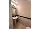 Powder bathroom featuring pedestal sink, elegant mirror, and black trim at 5114 Hawkstone Dr, Sanford, FL 32771
