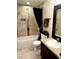 Bathroom with a modern vanity, granite counters, tiled shower and tub at 5114 Hawkstone Dr, Sanford, FL 32771