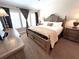Comfortable bedroom featuring a decorative headboard, natural light from the windows, and coordinated furnishings at 5114 Hawkstone Dr, Sanford, FL 32771
