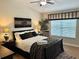 Cozy bedroom with modern decor, zebra rug and bright window at 5114 Hawkstone Dr, Sanford, FL 32771