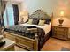Bedroom featuring window with drapes, and a beautiful bed frame at 5114 Hawkstone Dr, Sanford, FL 32771