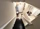 Top-down view of the foyer showing a mirrored wall, a dark wooden desk, and the front door at 5114 Hawkstone Dr, Sanford, FL 32771