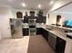 Well-equipped kitchen featuring stainless steel appliances and granite countertops, perfect for cooking at 5114 Hawkstone Dr, Sanford, FL 32771