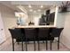 Kitchen bar with seating and an open layout overlooking the living areas at 5114 Hawkstone Dr, Sanford, FL 32771