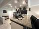 Modern kitchen with stainless appliances and granite countertops that open to dining area with breakfast bar at 5114 Hawkstone Dr, Sanford, FL 32771