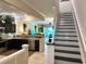 Open concept kitchen with dark cabinetry, granite countertops, and stainless steel appliances at 5114 Hawkstone Dr, Sanford, FL 32771