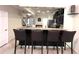 Modern kitchen with stainless appliances and granite countertops that open to dining and living area at 5114 Hawkstone Dr, Sanford, FL 32771