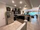 Modern kitchen featuring stainless steel appliances and seamless access to the living area, great for entertaining at 5114 Hawkstone Dr, Sanford, FL 32771