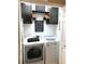 Efficient laundry area with modern washer, dryer, upper cabinets, and organized storage space at 5114 Hawkstone Dr, Sanford, FL 32771