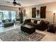 Cozy living room featuring comfortable seating and screened patio access with abundant light at 5114 Hawkstone Dr, Sanford, FL 32771